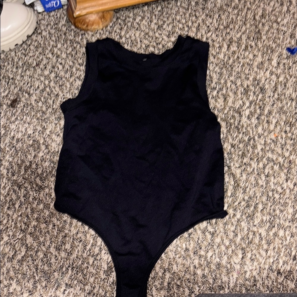 Black Sleeveless Bodysuit with High Neckline and High-Cut Leg Opening